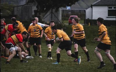 Mens team playing rugby